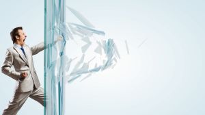 businessman breaking a glass